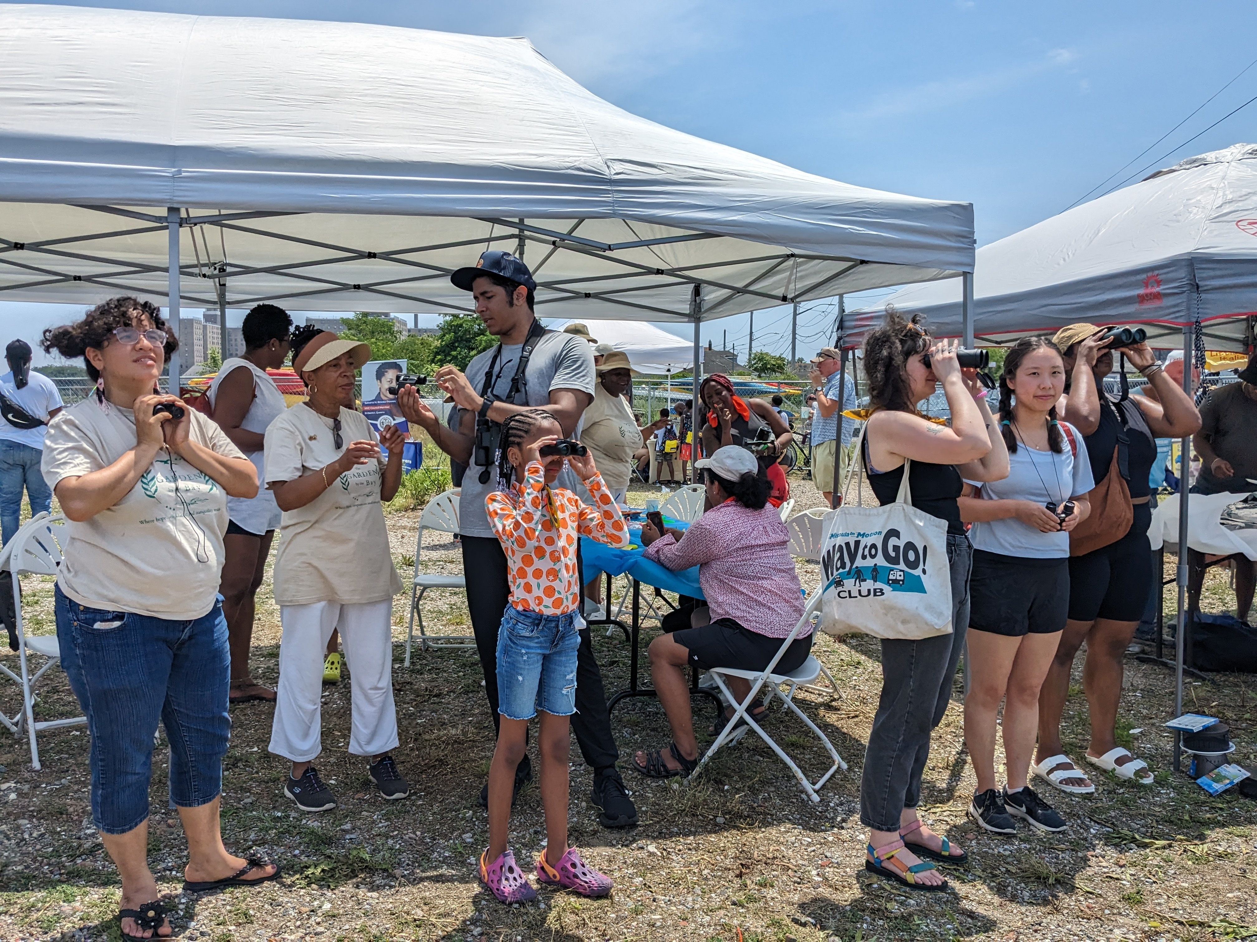 Far Rockaway residents from Beach 41st Street Houses and the surrounding community look for shorebirds at a NYCHA in Nature outing